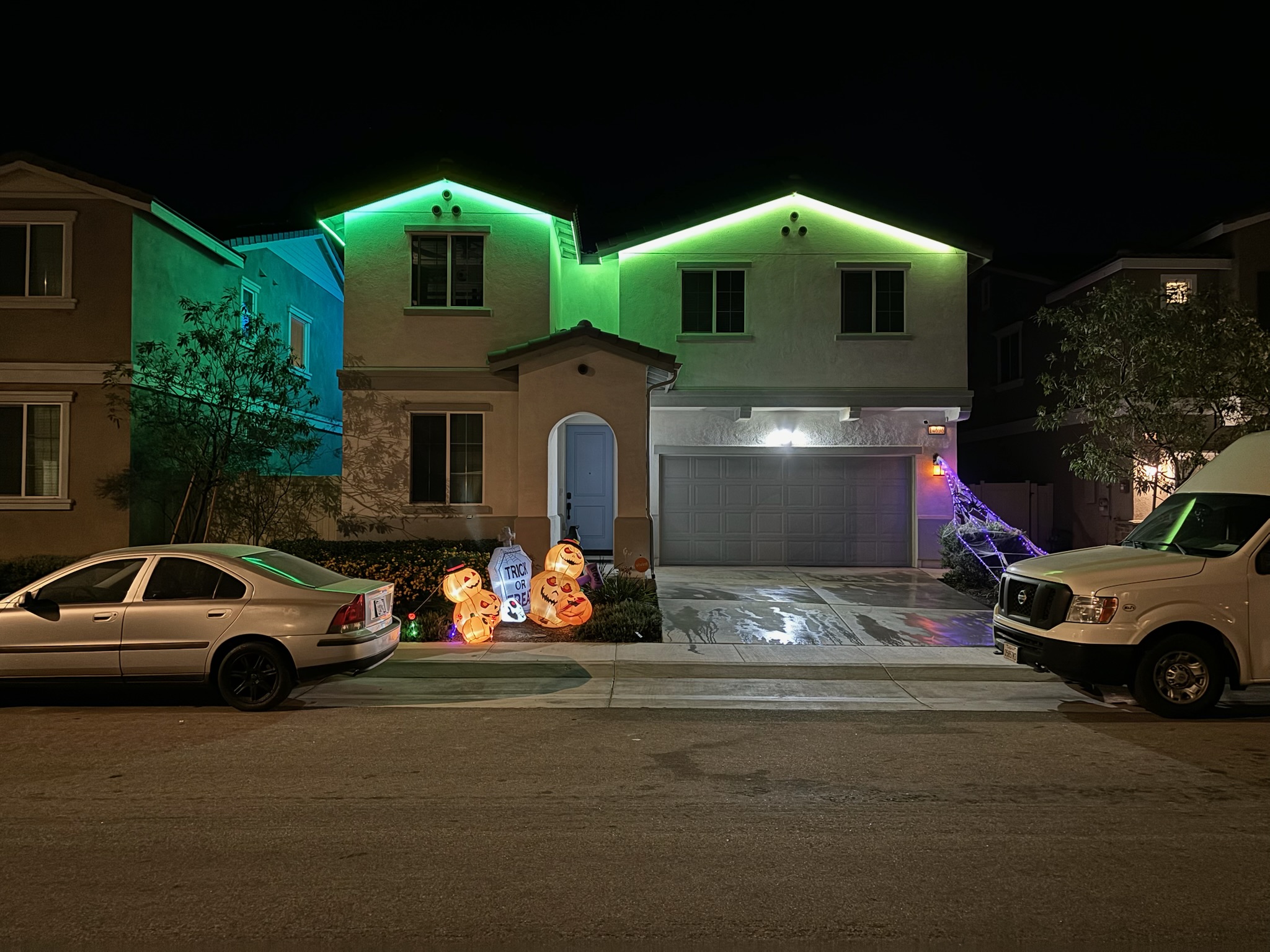 Green Govee roofline lights on a home at night