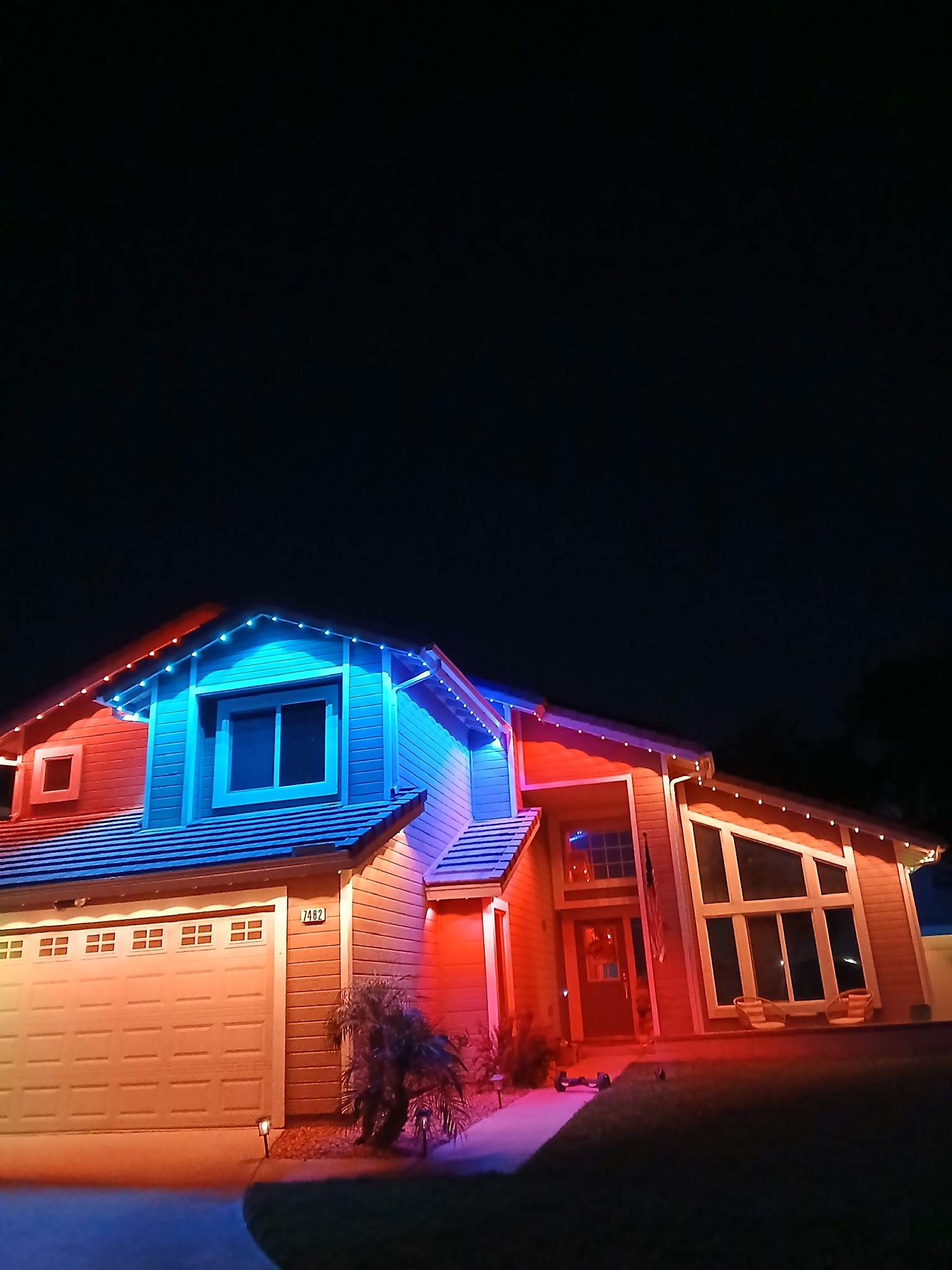 Home with red and blue Govee lights on the roofline