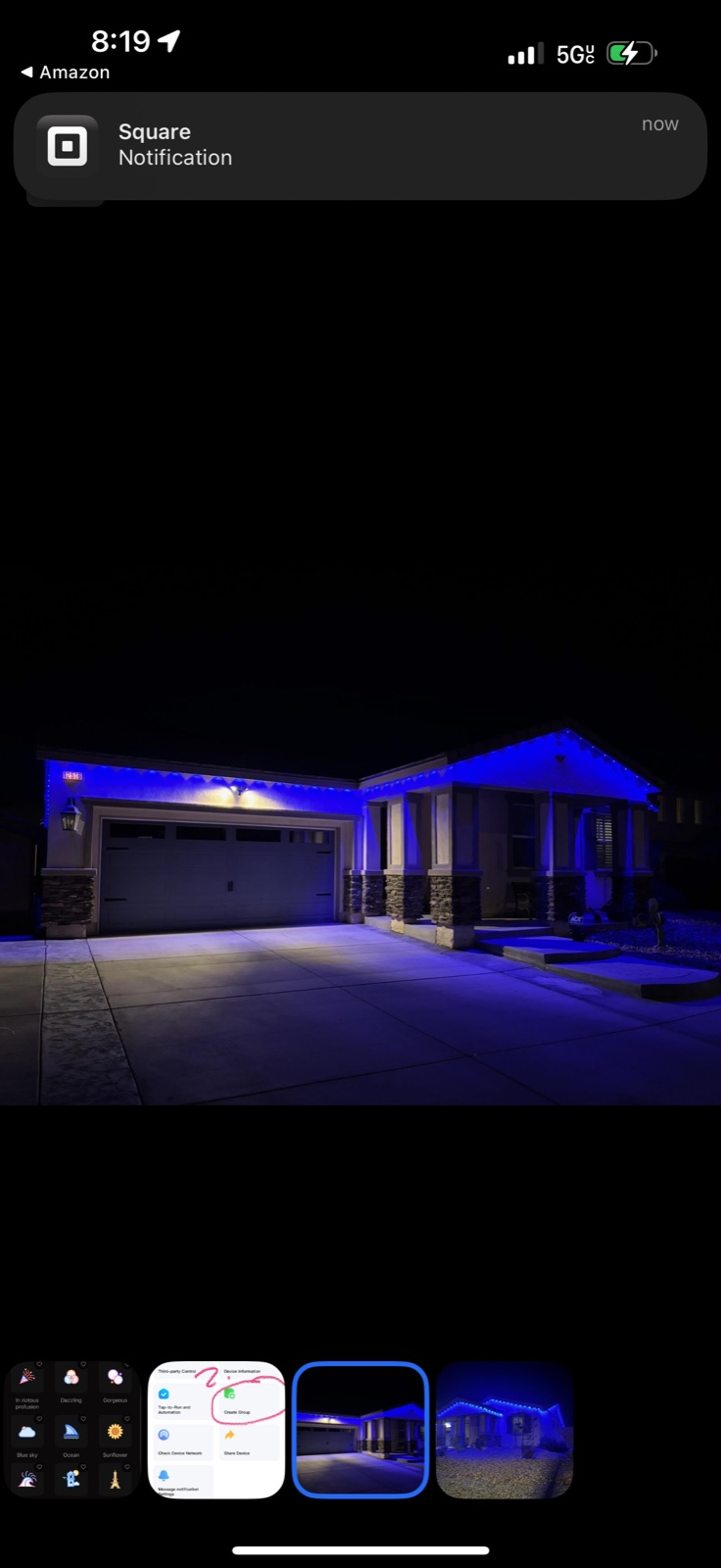 Tall real install photo showing blue Govee roofline lights on a home